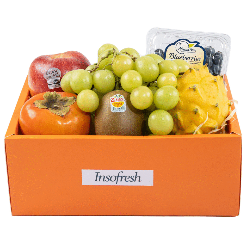 Insofresh fruit hamper delivery in Singapore featuring premium apples, kiwis, grapes, blueberries, and yellow dragon fruit in an elegant orange gift box.